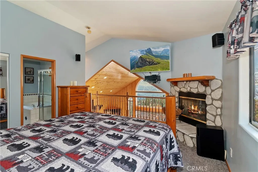 Top Level Primary Bedroom

Fire in fireplace has been digitally added