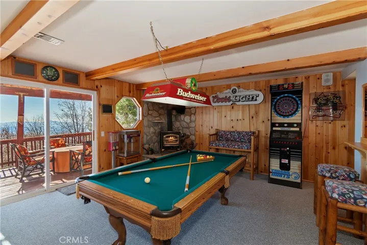Bottom Level Game Room With Bottom Deck Access

Fire in fireplace has been digitally added