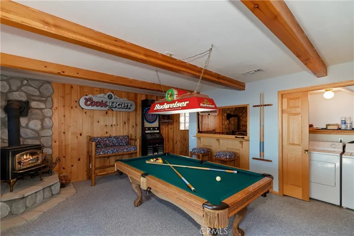 Bottom Level Game Room And Laundry Closet

Fire in fireplace has been digitally added