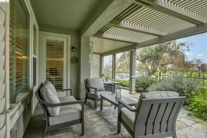 View of patio featuring a pergola and an outdoor living space