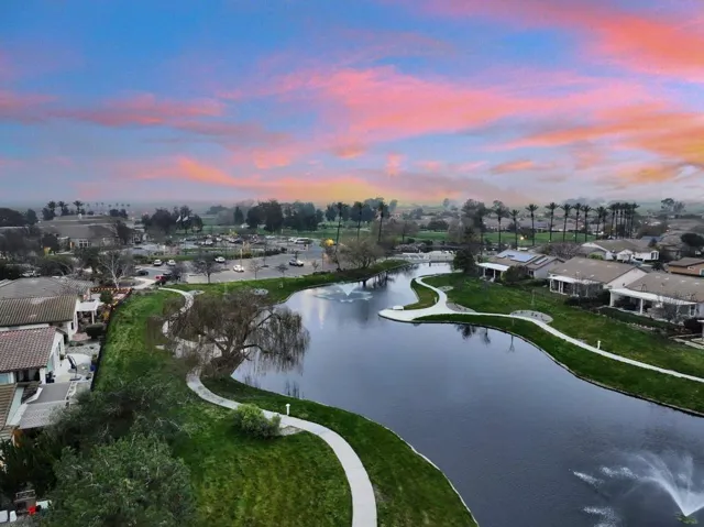 Aerial perspective of suburban area featuring a large body of water