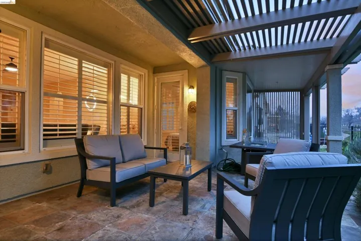 View of patio / terrace featuring a pergola and an outdoor hangout area