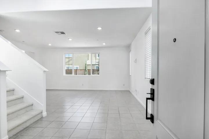 Foyer featuring stairway, recessed lighting, and light tile patterned floors