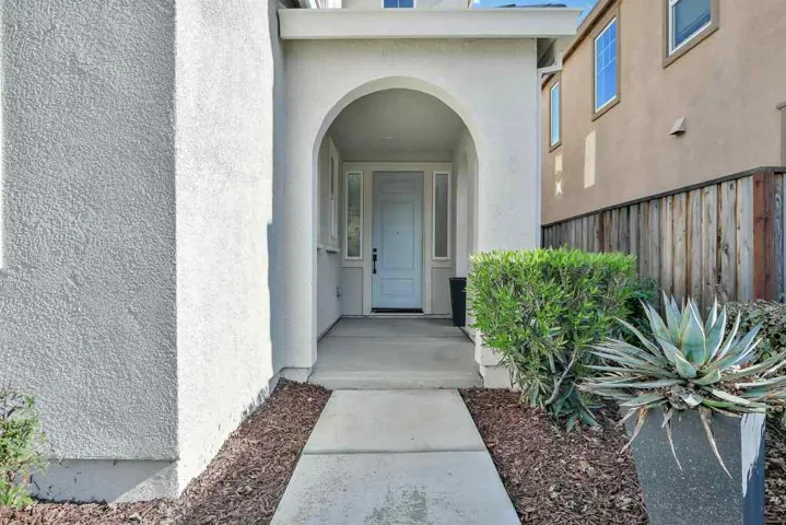 View of exterior entry featuring stucco siding