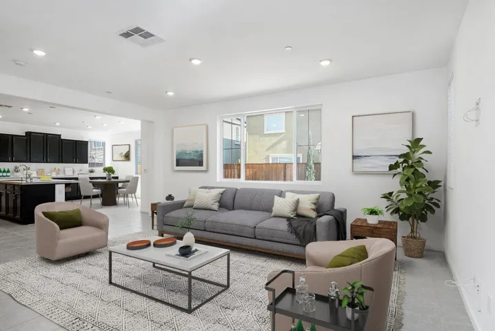 Living area with plenty of natural light and recessed lighting