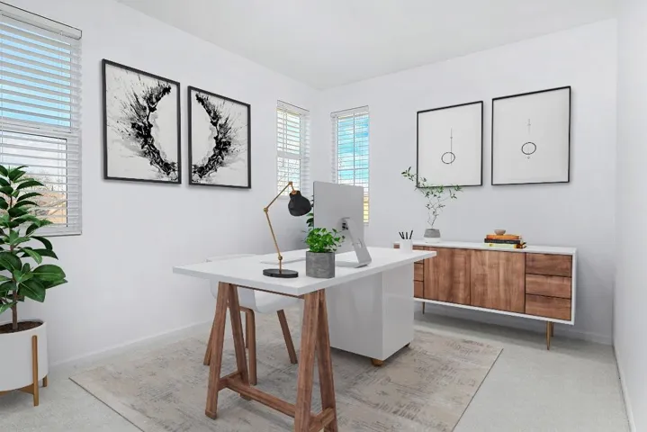 Home office featuring baseboards and light colored carpet