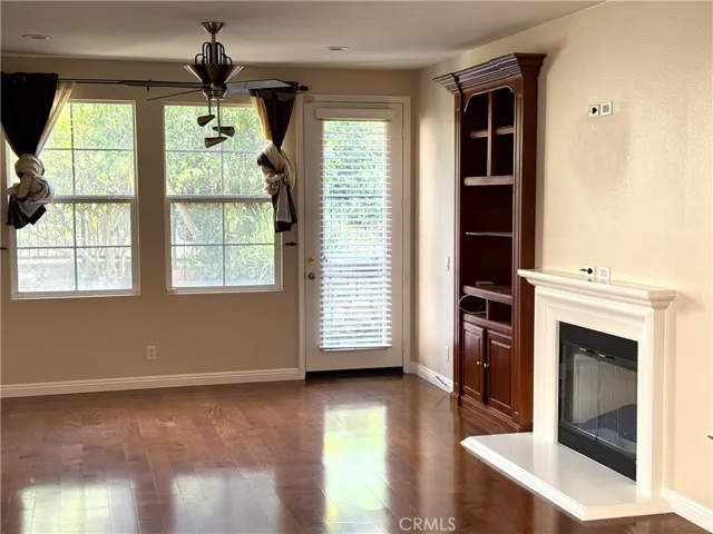 Family Room with Fireplace.  Lots of Light from Back Yard. Wired for Flat Screen T.V. Above the Fireplace.