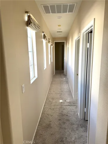 Hallway Leading to Bedrooms.  Light & Bright.