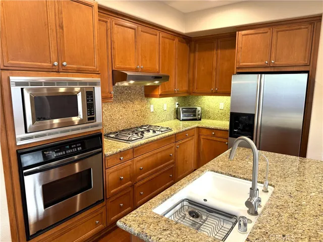 Kitchen with Granite Counters and Stainless Steel Appliances.