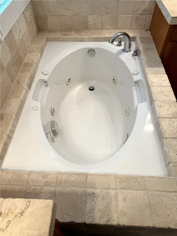 Jetted Tub.  Tumbled Marble Surround.