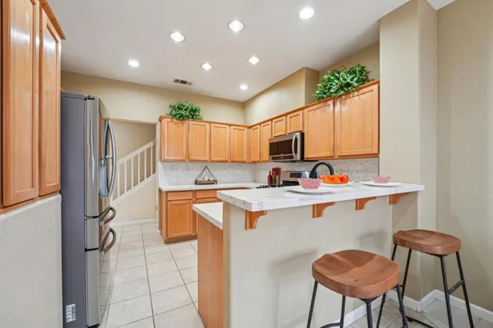 Kitchen with breakfast bar and bar stools
