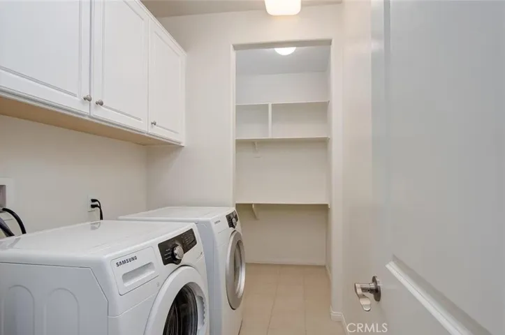 Upper lever laundry room with washer, dryer & stoage