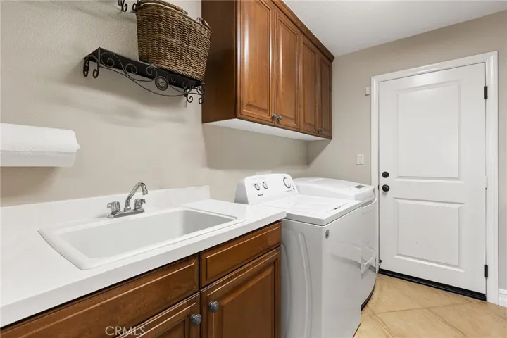 Lg. laundry with tons of built-in cabinets