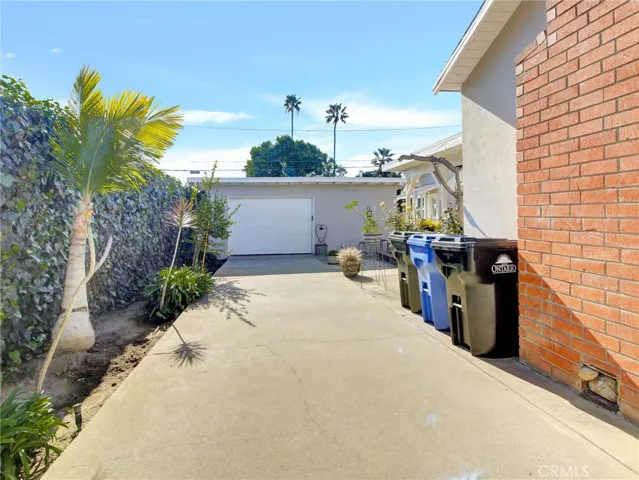 Driveway leading to one car garage