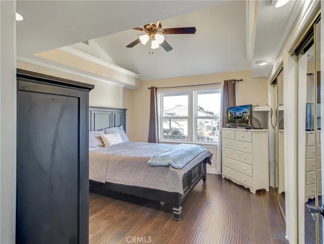 First bedroom with spacious mirror closet doors