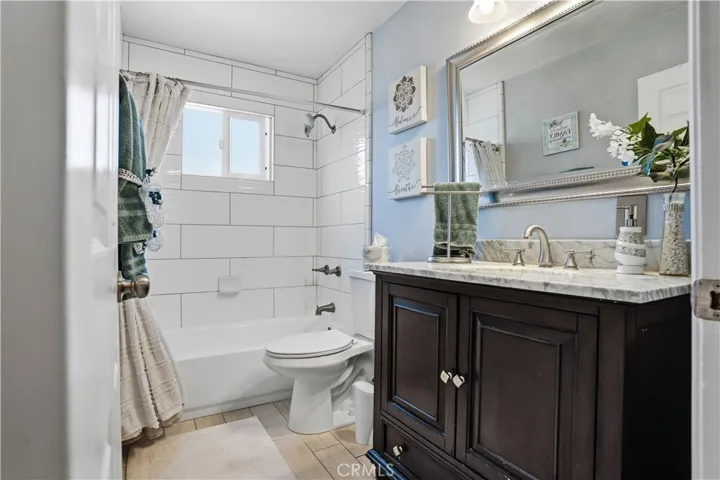 Guest bathroom at the end of the hall way in between bedroom #2 and Primary bedroom