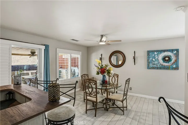 Dining area looks at the kitchen and the patio
