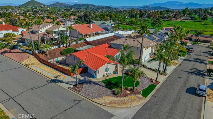 Huge corner lot with RV & Boat parking, pull through garage, views of golf course and hills.