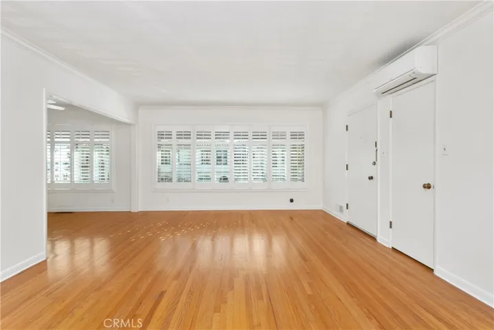 Light and bright with plantation shutters.