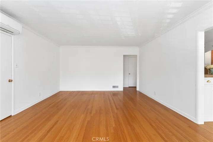 Beautiful hardwood floors, HVAC split in living room.