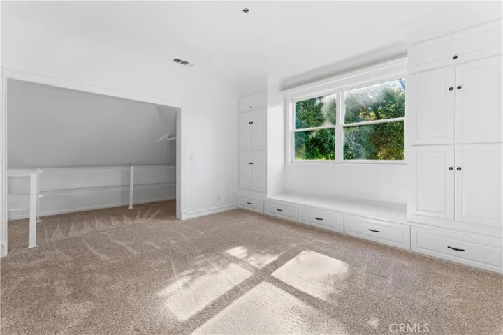 Bedroom with custom built in cabintry
