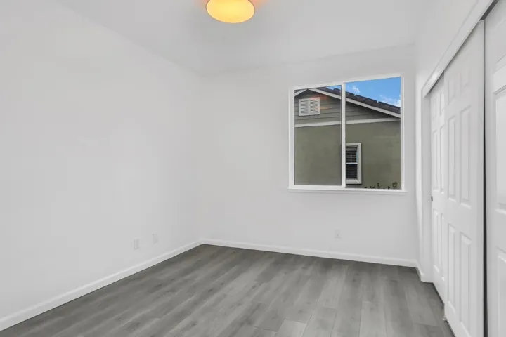 Unfurnished bedroom featuring a closet and light wood finished floors