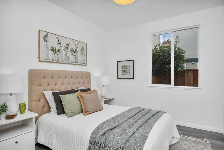 Bedroom featuring baseboards and wood finished floors