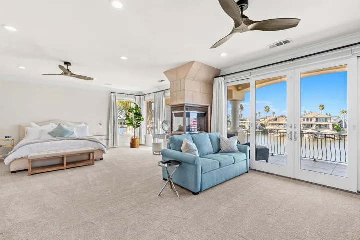 Bedroom with access to exterior, ceiling fan, crown molding, carpet, and recessed lighting
