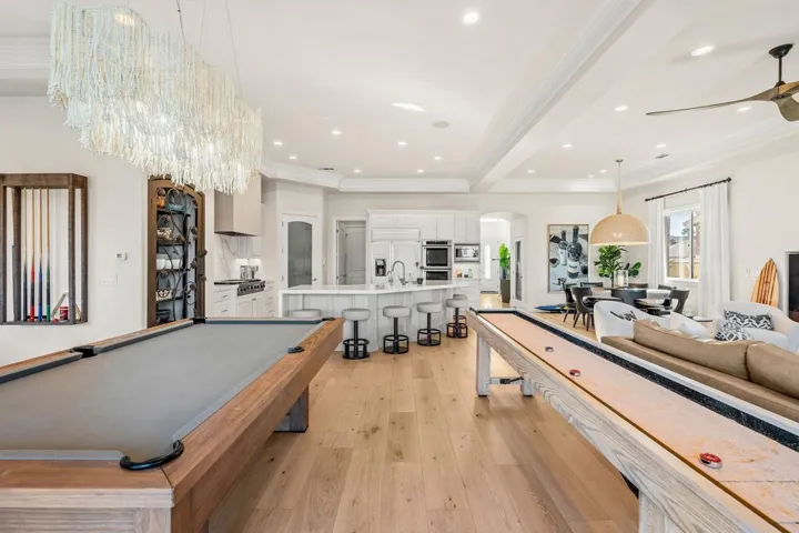 Playroom with light wood-style floors, billiards table, arched walkways, crown molding, and recessed lighting