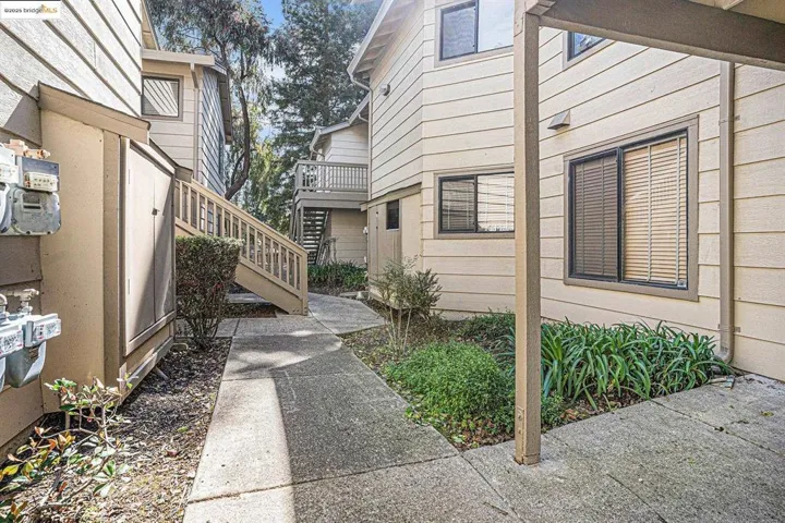 View of side of property featuring stairs