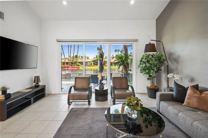 Living Space with sliders to waterfront patio