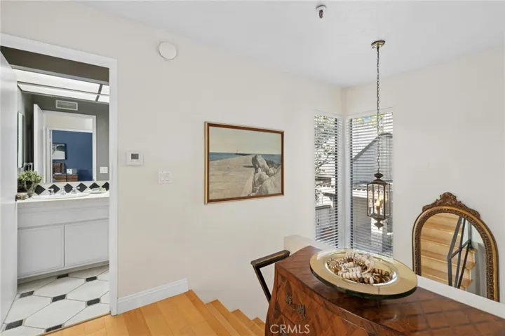 Upper landing is sunlit from two story, corner windows… second full bath