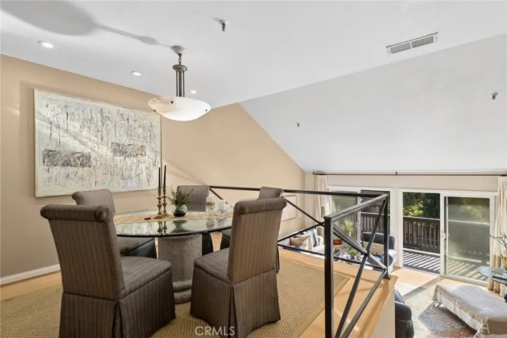 Elegant dining area overlooks the sunlit living room