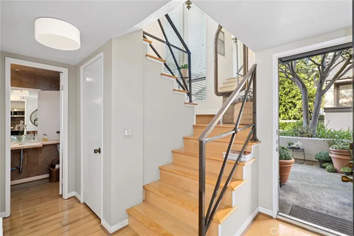Entry landing with closet, laundry area and powder bath