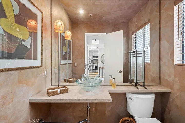 Conveniently located powder bath designed for guest use with easy access from main living areas