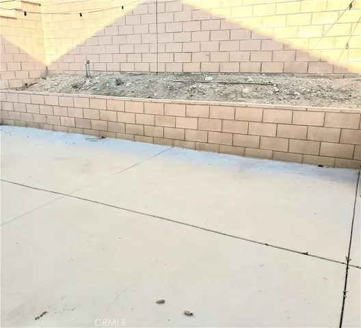 Finished off backyard with concrete and drain system & retaining wall for planter.