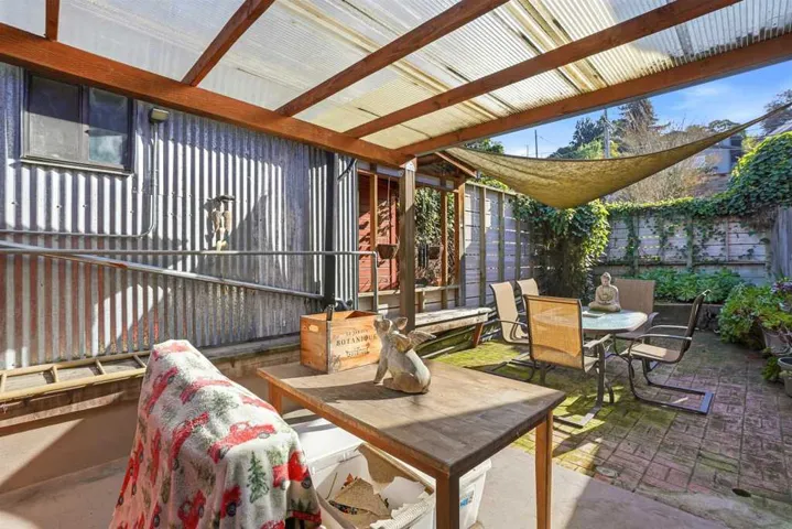 This unit has a serene , quiet, back yard that serves as a retreat to refresh and relax. It has room enough for a backyard dining experience with friends.