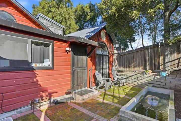 The largest unit in the property,offers a spacious 2-bedroom layout,separate kitchen & full bathroom. Additional features include a dedicated storage room,laundry room and direct access to a private, serene front yard oasis.Access to private parking.