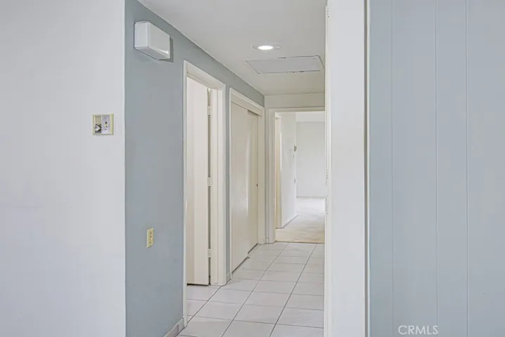 Hallway leading to bedrooms and bathrooms.