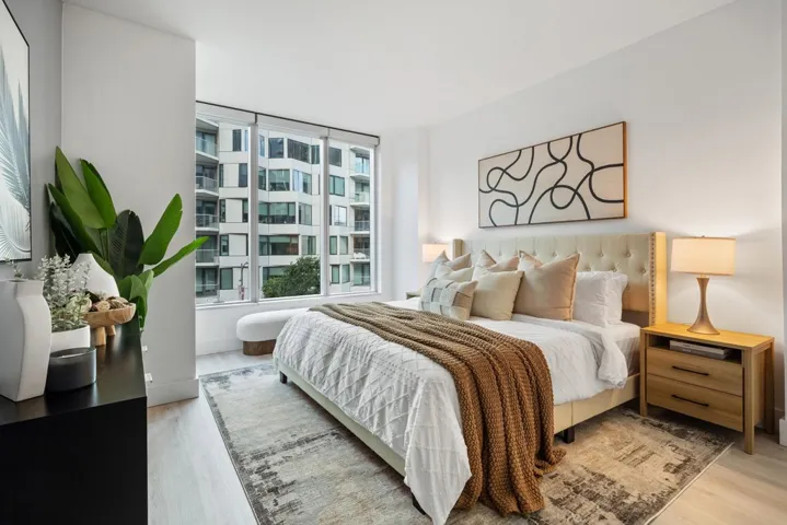 Bedroom with wood updated reengineered floors and baseboards