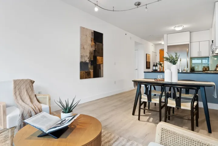 Dining room with light wood-style flooring and baseboards