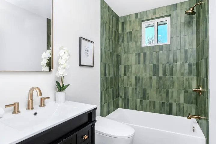 Full bath featuring vanity and shower / washtub combination