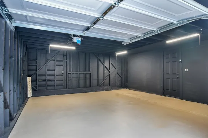 Garage featuring a garage door opener