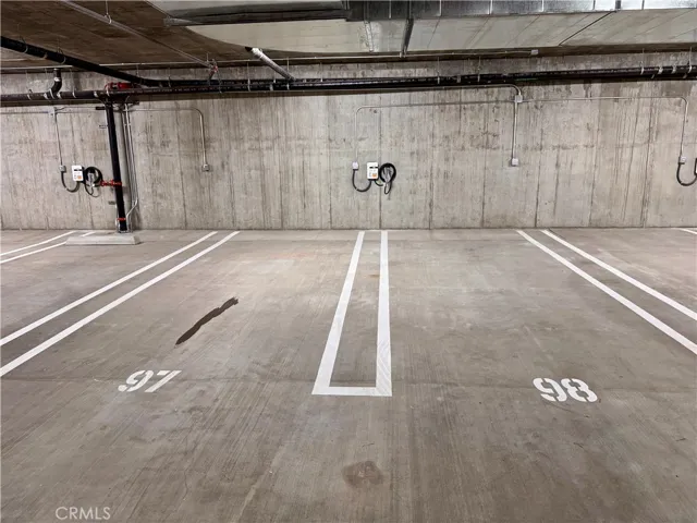 Parking spaces w/ charging at tenant's expense