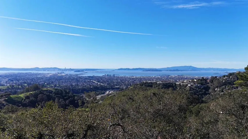 View of mountain backdrop featuring a large body of water