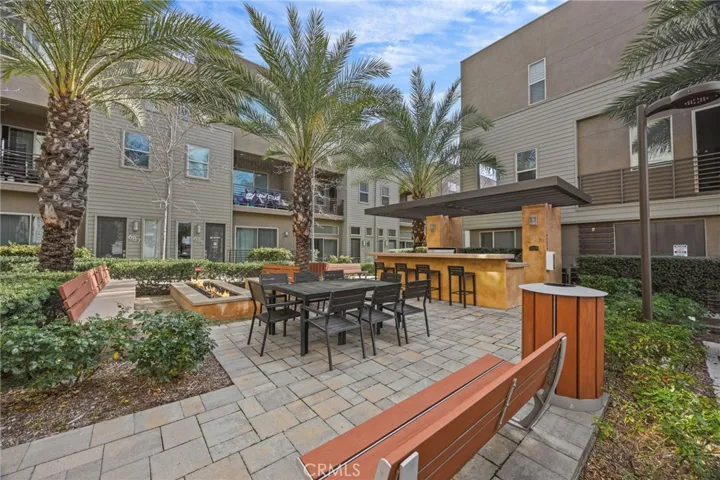 BBQ, fire pit and outdoor dining area by community mailboxes