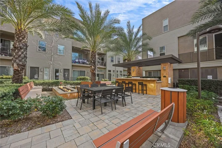 BBQ, fire pit and outdoor dining area by community mailboxes