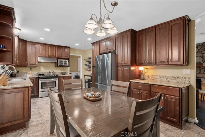Spacious kitchen with updated cabinetry and granite counters.