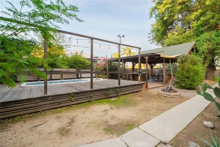 Raised deck with swim spa and traditional spa.
