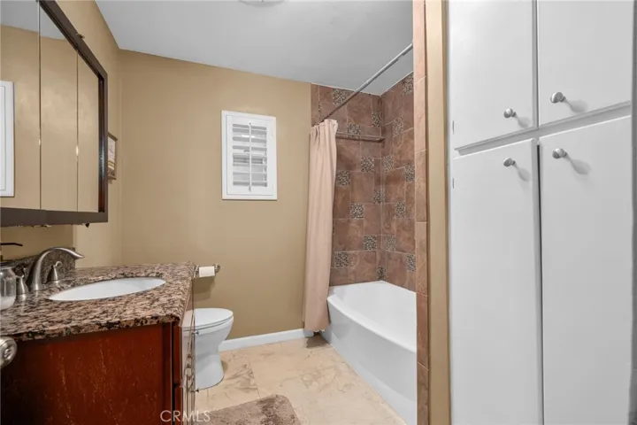 Full bathroom with lots of storage.